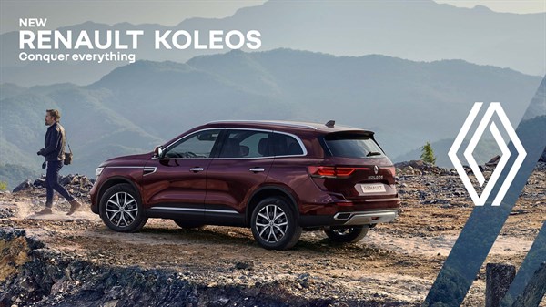 A Renault Koleos parked on top of a mountain.