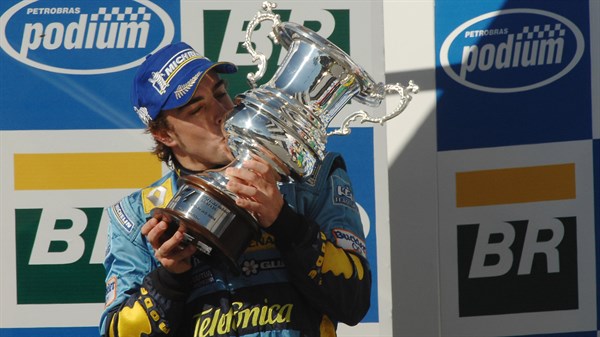 Renault in Formula One - Renault Team driver holding the Championship Cup