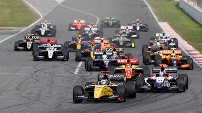 A group of Renault Motorsport vehicles running on the track