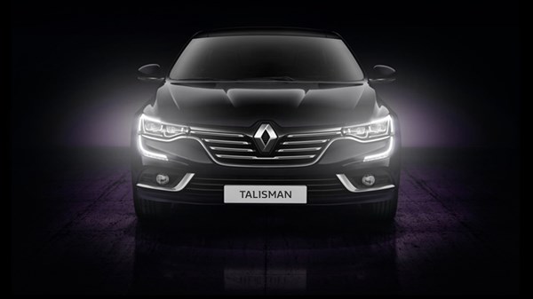 A front view of the Renault TALISMAN with its LED lights turned on