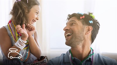 A girl and a man are smiling looking each other
